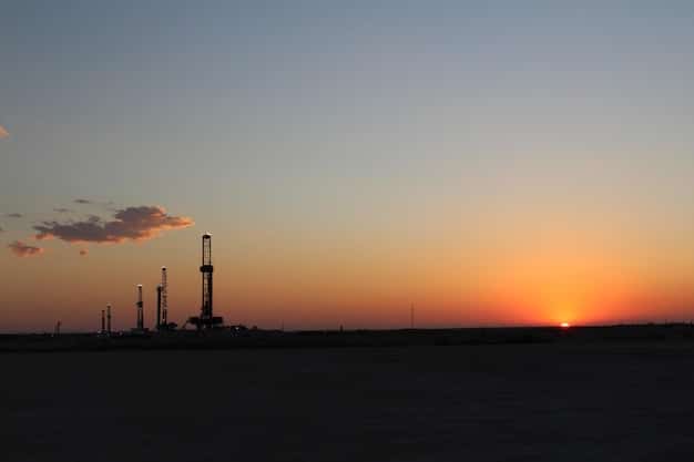 An aerial view of a sprawling oil and gas field at sunset, with visible flares. Superimposed on the image are lines and arrows indicating methane plumes, representing the challenge of monitoring widespread emissions.