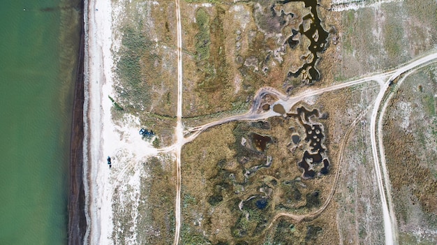 A satellite image showing widespread coastal flooding along the Gulf Coast, with submerged roads and homes, and salt marsh ecosystems being overtaken by ocean water.