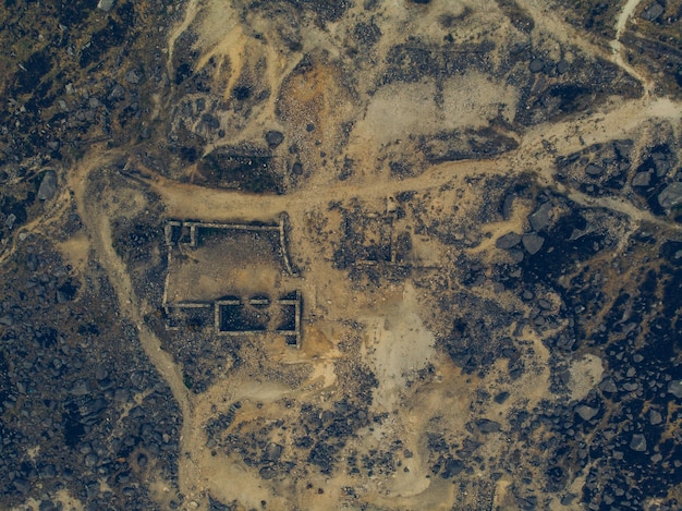 Satellite image showing a widespread drought-affected landscape in the Western US, with parched land and depleted reservoirs.