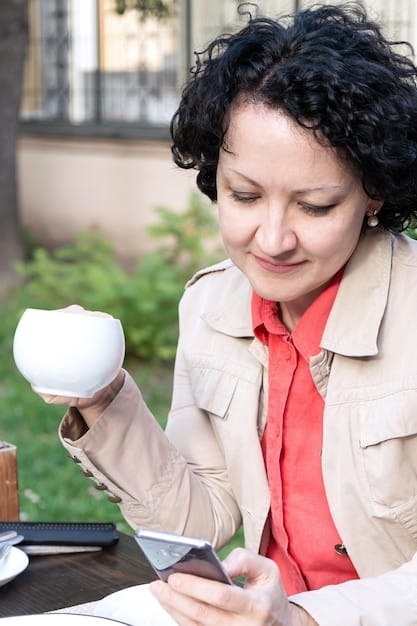 A close-up of a homeowner smiling while reviewing a utility bill with significantly reduced energy costs, illustrating financial savings from green building.