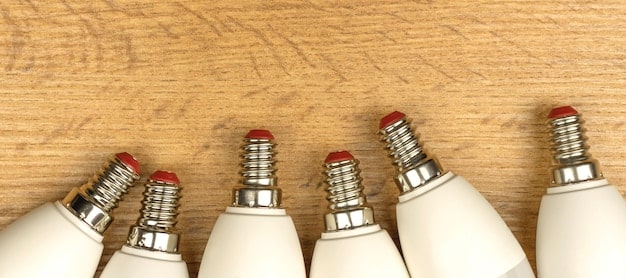 A clear, side-by-side comparison chart illustrating the energy consumption and annual cost savings of different light bulb types (incandescent, CFL, LED) in a household setting.